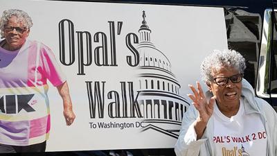 Opal Lee waving to crowd on her walk