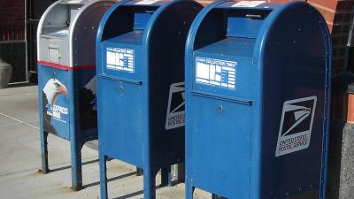 Three large mailboxes in front of post office