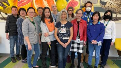 Chinese team members standing together and smiling