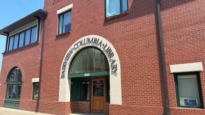 Exterior of Fairview Columbia Library, brick building and front doors, large Fairview-Columbia Library sign.