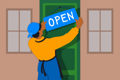 A person wearing a blue bandana and navy apron hanging a blue "OPEN" sign on a green door