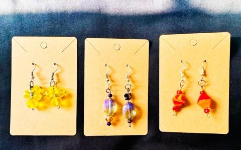 photograph of three pairs of handmade earrings in different colors