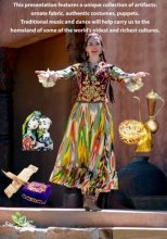 Image of woman in colorful outfit surrounded by puppets and metal dishes