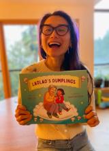 Image of author Dane Liu holding her book LaoLao's dumplings