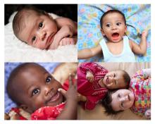 4 baby faces look at the viewer with various smiles and serious expressions. Skin tones range from pale white to dark brown.