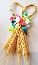 Photograph of braided wheat with ribbons