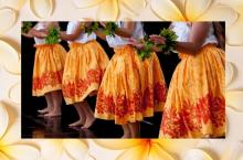 four dancers in orange hula skirts