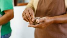 Hands molding clay