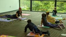 Photo of Teresa Lai teaching a children's yoga class