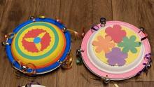 Two handmade colorful tamborines