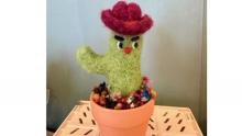 photo of a felted cactus with a hat