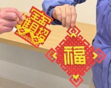 Photo showing 2 example crafts with perler beads