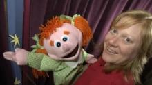 Photo of Penny with one of her puppets