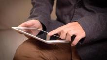 Photo of a person using a device with a touchscreen