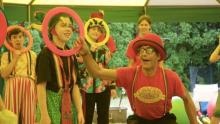 Photo of a person from Circus Cascadia performing with children