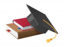 A black graduation mortar-board with gold tassel resting on a stack of 3 text books
