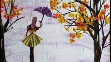 Photo of an art piece made by Kim Newman with organic materials depicting a person in the rain with an umbrella