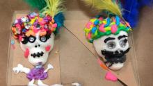 two colorful sugar skulls