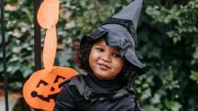 Photo of a Black child dressed up as a witch for Halloween.
