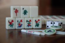 Photo of Mahjong tiles stacked.
