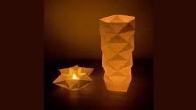 Photo of an origami lampshades with lights inside