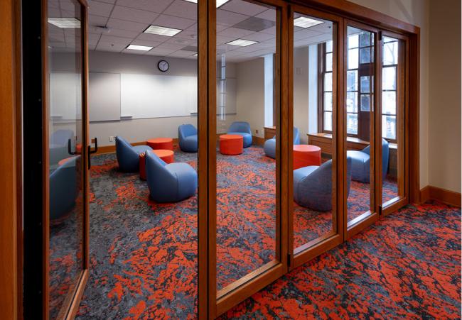 Inside Central Library in a meeting room with comfortable chairs throughout