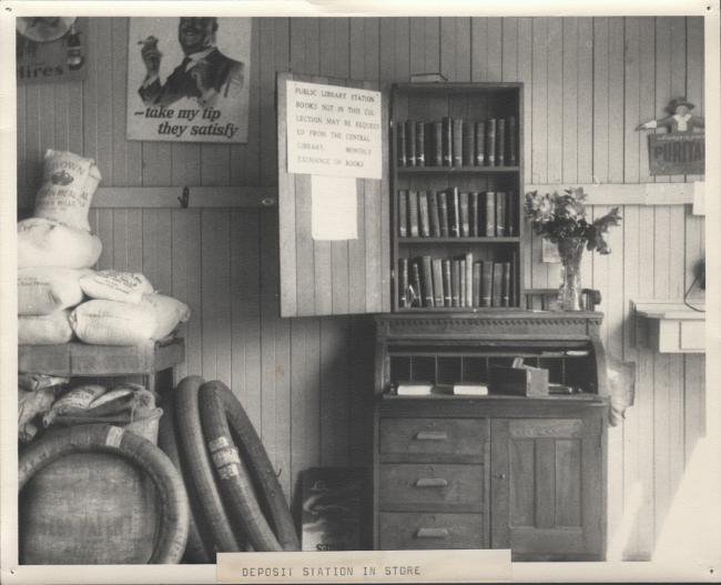 An old photograph of a deposit station, a bookshelf inside a store.